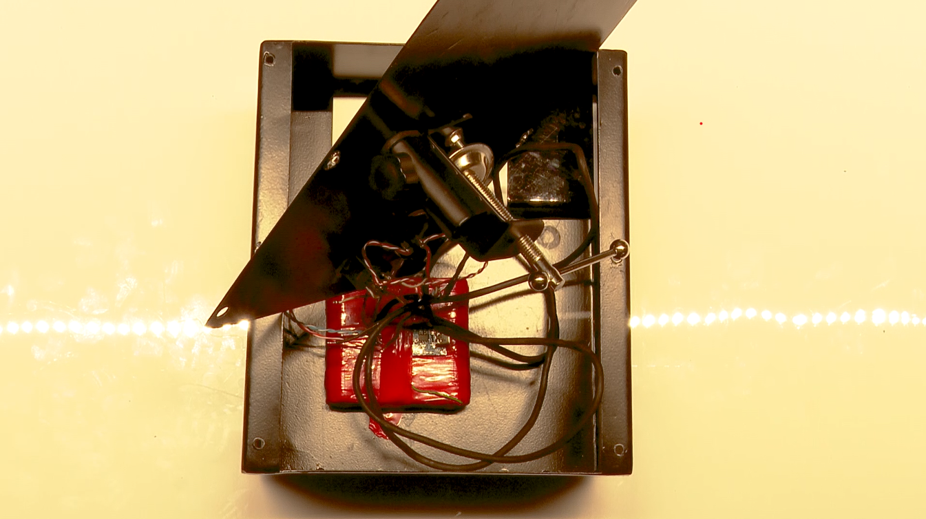 Inside the base: pack, controller, ports, wiring