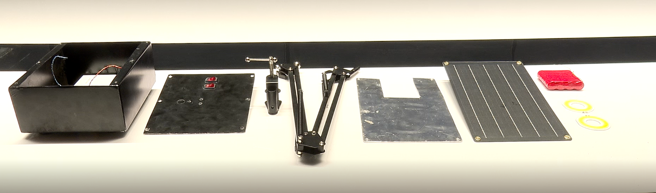 All parts laid out: cells, controller, wiring, LEDs, arm, hardware